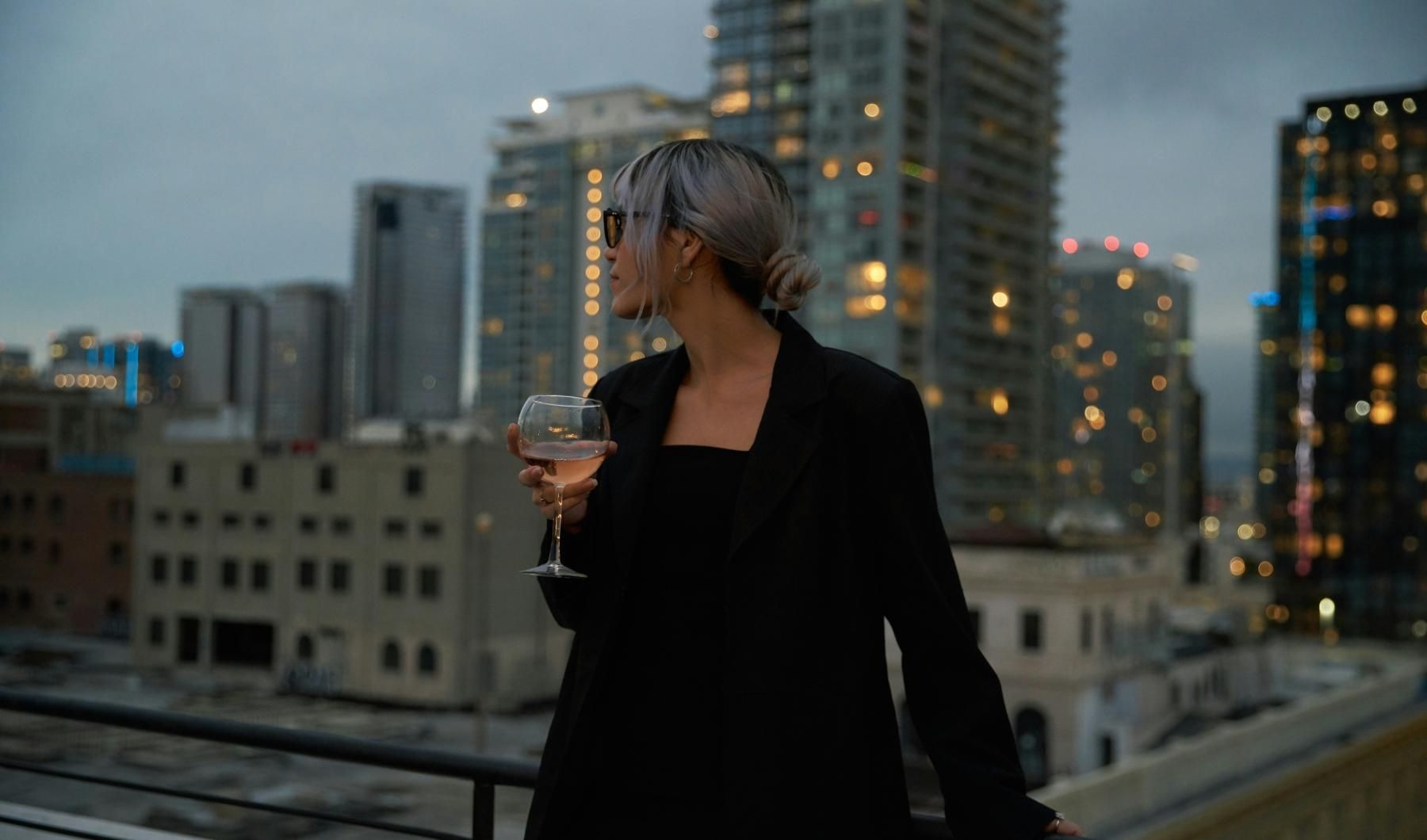 a person holding a glass of wine