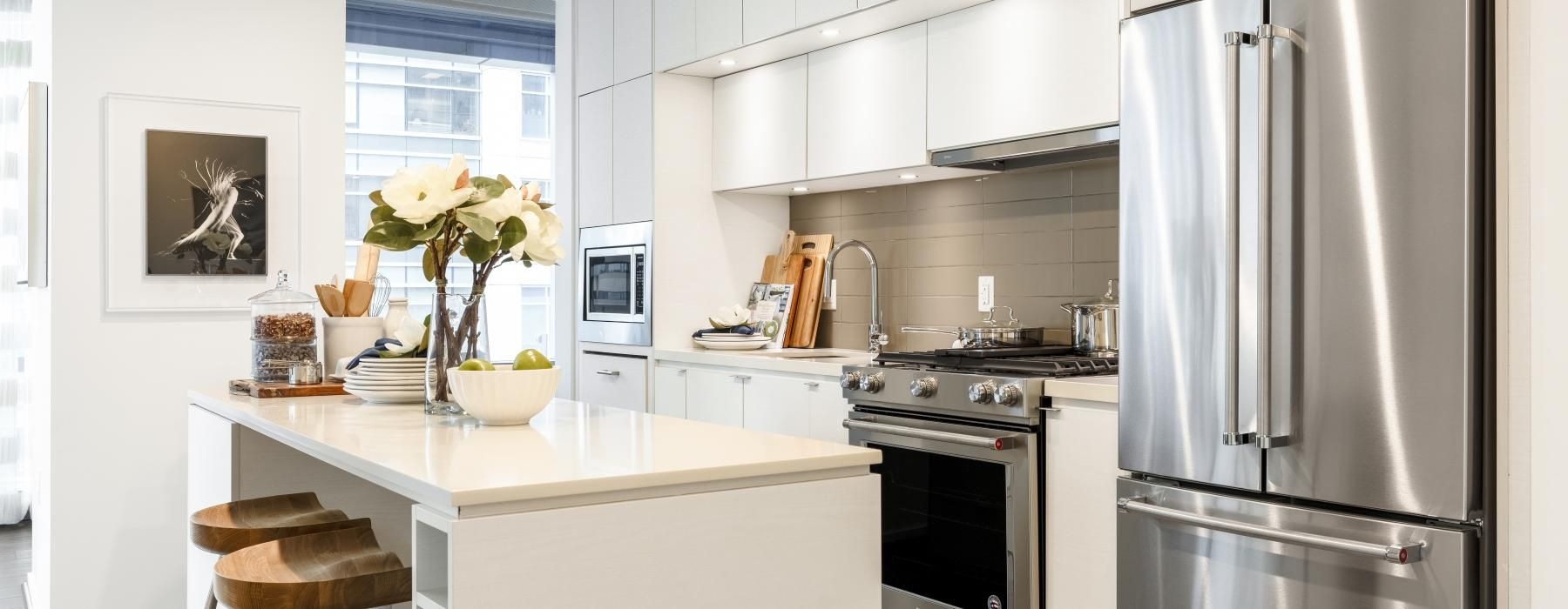 a kitchen with white cabinets