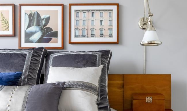 a bed with a lamp on the side