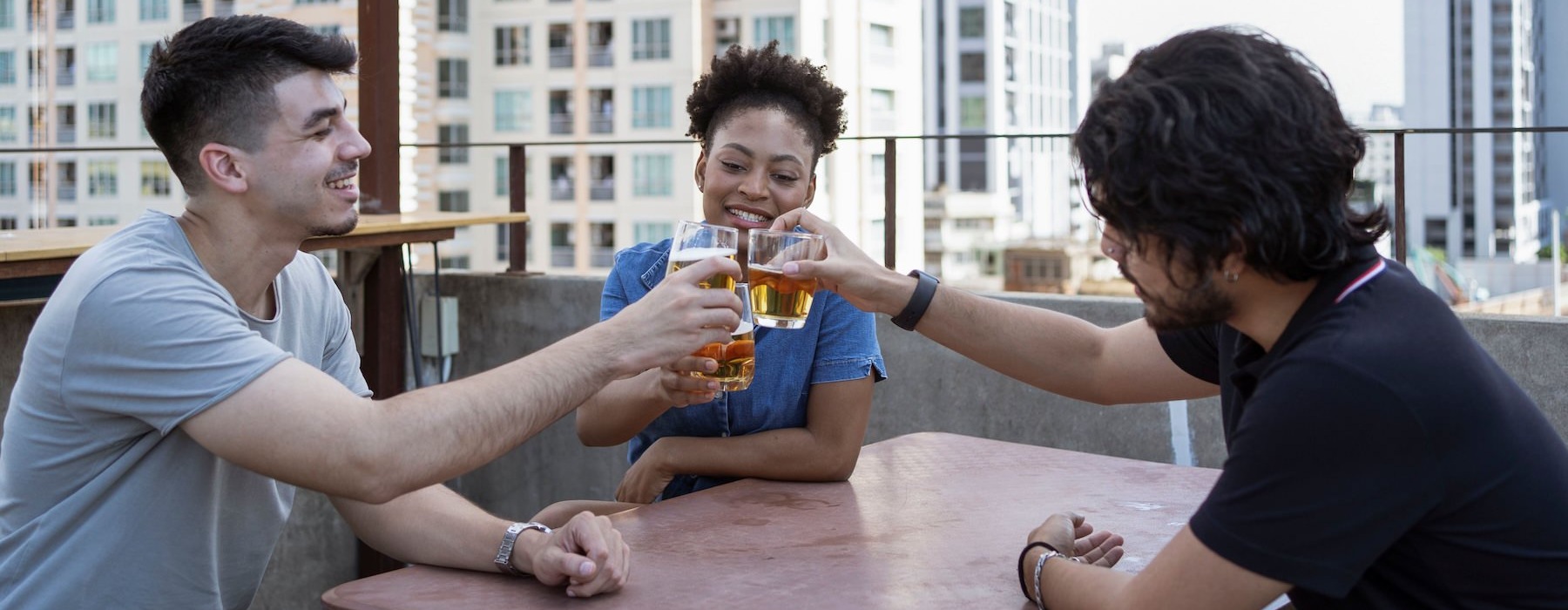 a group of people sitting at a table with drinks
