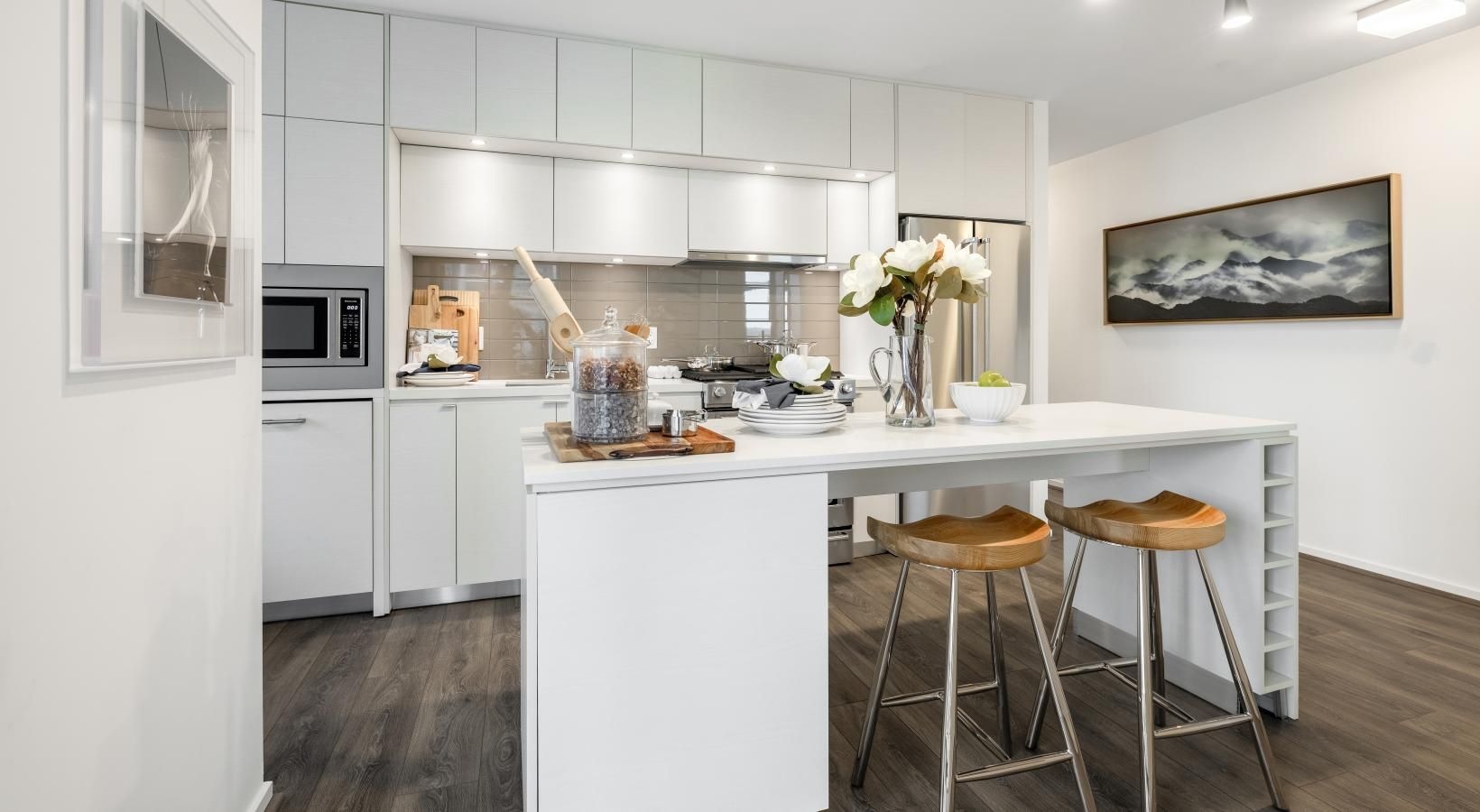 a kitchen with white cabinets